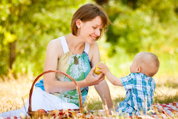 Mom and son have a picnic