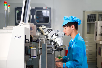 Chinese worker on factory check product