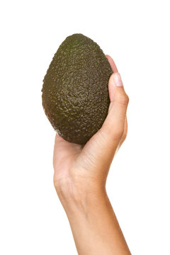 Hand with an avocado