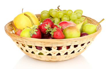 Mix of ripe sweet fruits and berries in basket isolated on