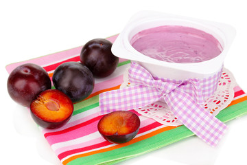 Yogurt with blueberries and plums isolated on white