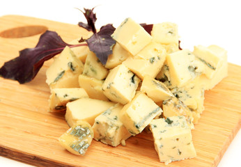 Tasty blue cheese on cutting board, isolated on white
