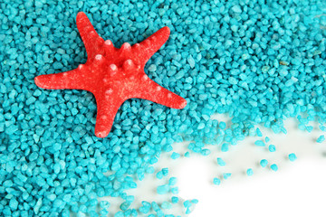 Starfish on blue crystals of sea salt background