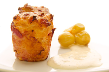 two cheese muffins with pickled grapes and sauce
