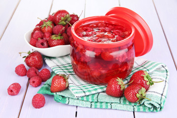 Home made berry jam on wooden table