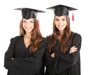 Two happy graduating students isolated on white
