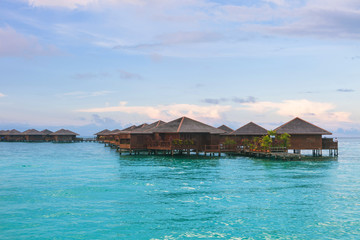 Over water bungalow with bule sky