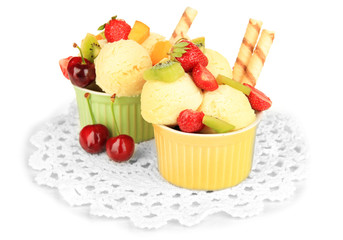 Delicious  ice cream with fruits and berries in bowl isolated