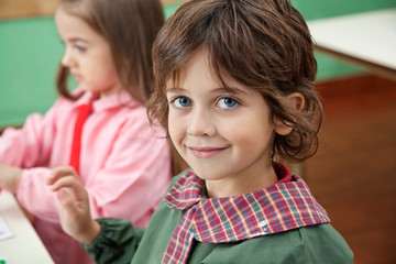 Little Boy Smiling With Classmate In Background