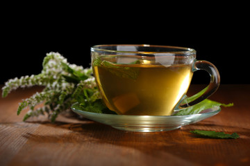 Cup of herbal tea with fresh mint flowers