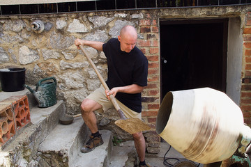 man mixing mortar in the blender