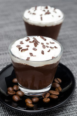 chocolate-coffee mousse with whipped cream in glasses