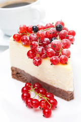 close-up of piece of cheesecake with red and black currants