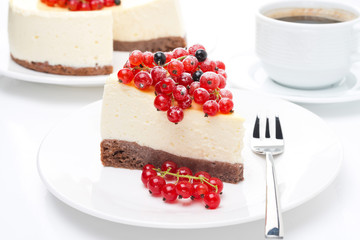 close-up of piece of cheesecake with red and black currants