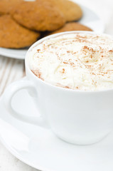 cocoa with cinnamon and whipped cream, oatmeal cookies