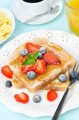 crispy toast with honey, fresh berries, cup of coffee