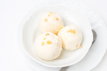 Ginger ice cream with melted milk, top view