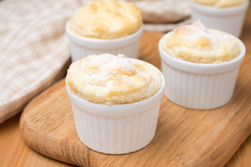 peach souffle in the portioned form on a wooden board