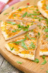 sliced ​​chicken pizza with tomato sauce, cheese and parsley
