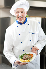 Chef holding a dish