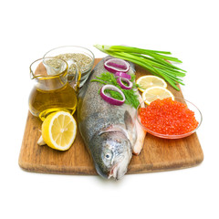 fresh raw trout and caviar on a cutting board. white background.