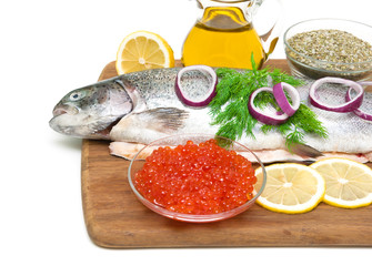 red caviar and fresh trout on a cutting board