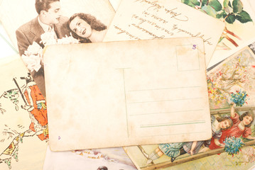 Group of vintage postcards, with empty one in the centre