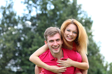 Fototapeta premium Happy young couple in love at the park