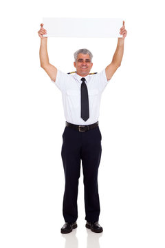 airline pilo holding horizontal white board