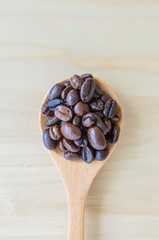 Coffee beans on spoon