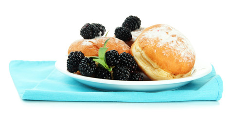 Tasty donuts with berries, isolated on white