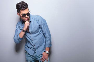 Fototapeta premium casual man with his hand on his chin