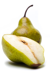 A pear with a slice isolated on white