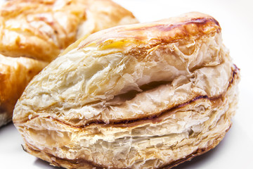 Delicious freshly baked pies on white background.