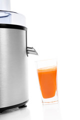 Fresh carrot juice with juicer isolated.