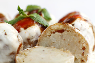 Closeup of delicious half cut banana dahi vada