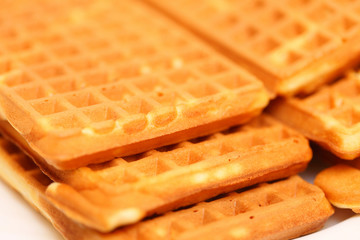 Stack of sweet belgian waffles on plate