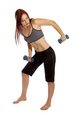 Fototapeta premium Young woman using hand weights in her workout.