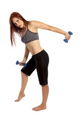 Pretty woman with red hair works her triceps with hand weights.