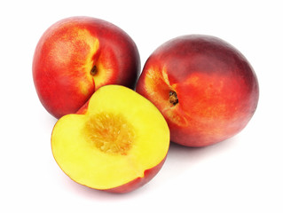 Ripe peaches isolated on white background