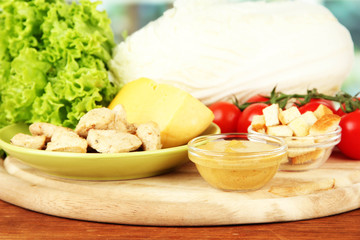 Ingredients for Caesar salad on bright background