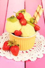 Delicious  ice cream with fruits and berries in bowl