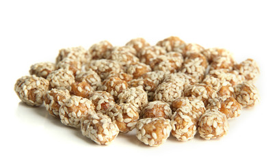 Tasty peanuts with sesame and caramel, isolated on white