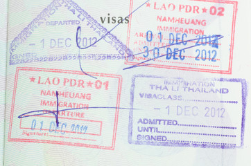 passport with thai and lao stamps