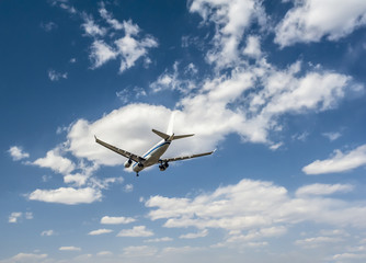 Fototapeta na wymiar Airplane on the sky background