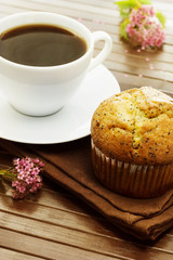Delicious poppy seed muffins with a cup of coffee