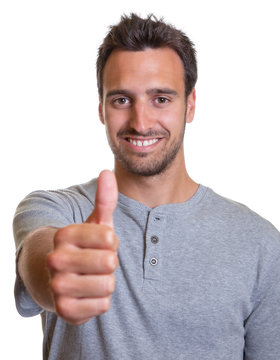 Latin man showing thumb