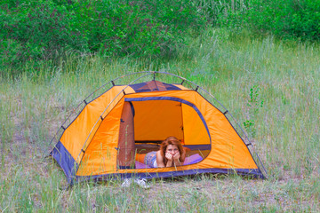 beautiful girl sin in a touristic tent