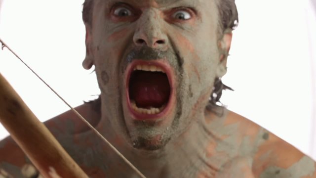 fierce facial expressions and grimaces of a primitive man