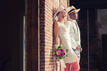 Vintage fashion romantic wedding couple in old urban building. M